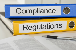 folders with the label compliance and regulations