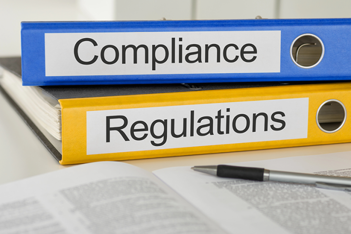 folders with the label compliance and regulations