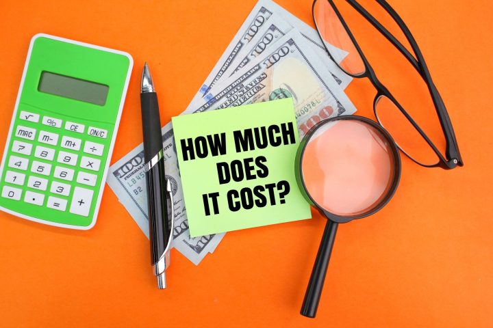 calculator-pen-paper-money-glasses-magnifying-glass-with-words-how-much-does-it-cost-2048x1365
